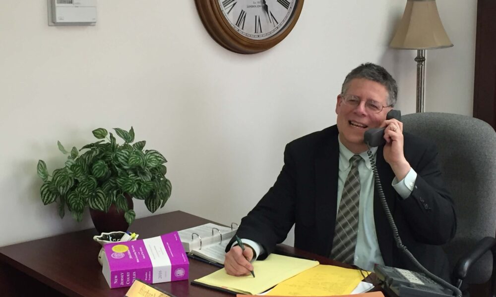 rich_desk_large_featured Owner at desk working